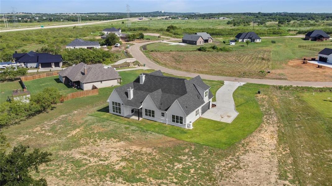 Front exterior of a new home in , Joshua, TX, highlighting curb appeal (Image 21).