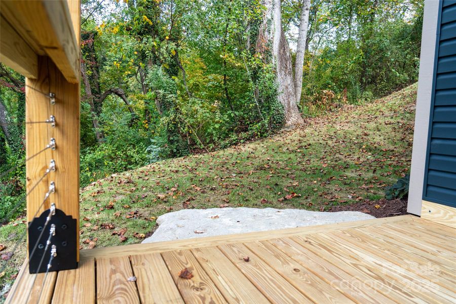 Lower deck leads to level side yard perfect for your future outdoor space