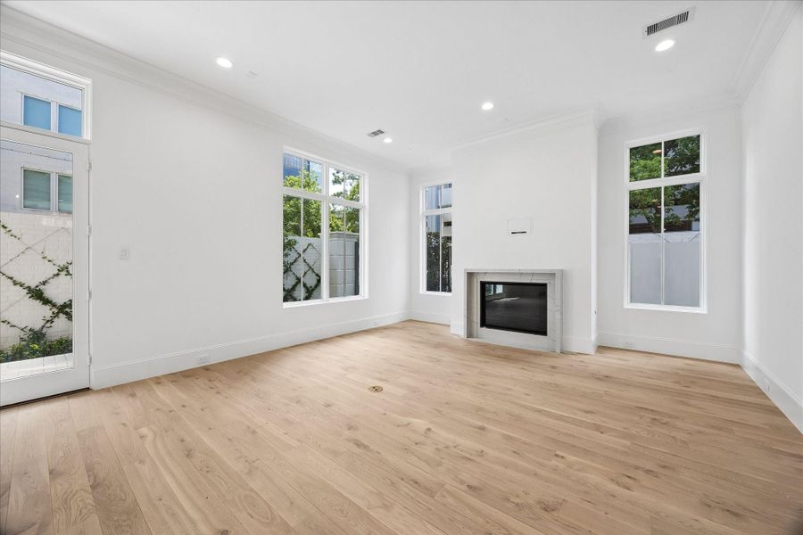 The centerpiece of the living room is this elegant 42” direct vent fireplace with stone facade.