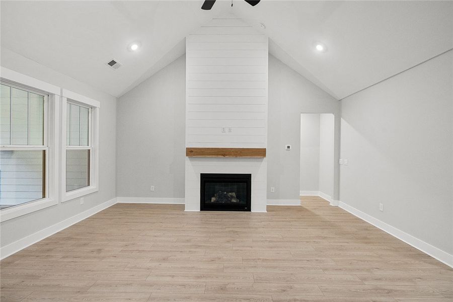 Vast vaulted ceilings and plank flooring frame a c Vast vaulted ceilings and plank flooring frame a c
