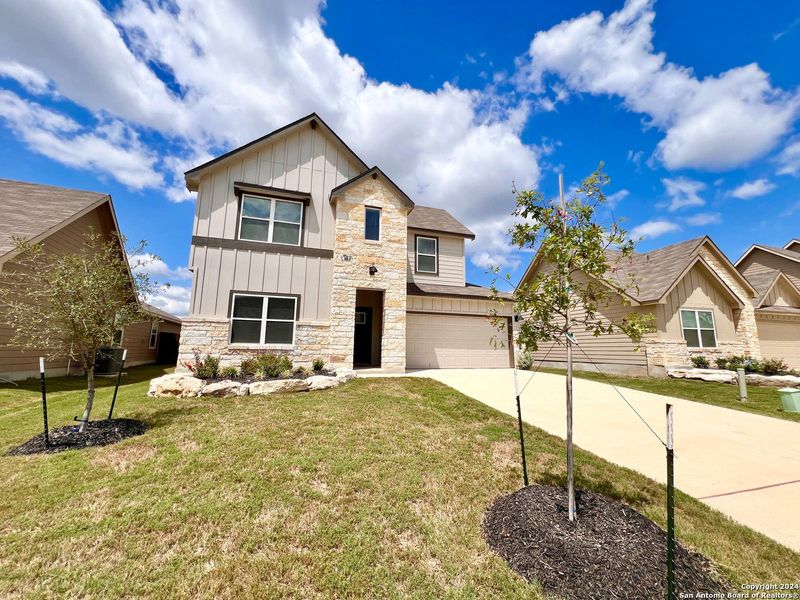 Front exterior of a new home in Brookstone Creek, San Antonio, TX, highlighting curb appeal (Image 27). Front exterior of a new home in Brookstone Creek, San Antonio, TX, highlighting curb appeal (Image 27).
