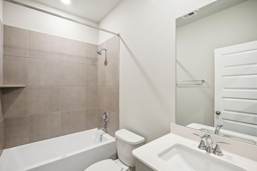 Furnished interior view inside a new home in Massey Oaks - Premier Series, Pearland (Image 11). Furnished interior view inside a new home in Massey Oaks - Premier Series, Pearland (Image 11).