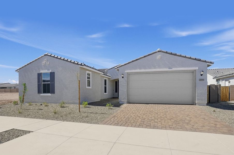 Front exterior of a new home in Artisan at Asante, Surprise, AZ, highlighting curb appeal (Image 16).