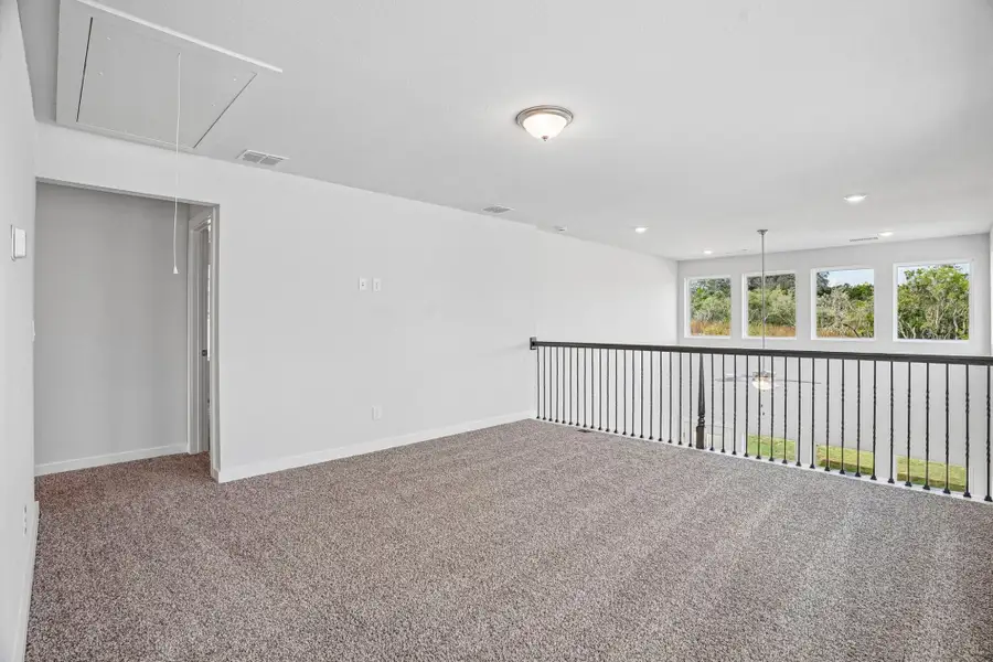 Spacious, unfurnished interior of a new home in The Meadows at Hunters Ranch, San Antonio (Image 28).