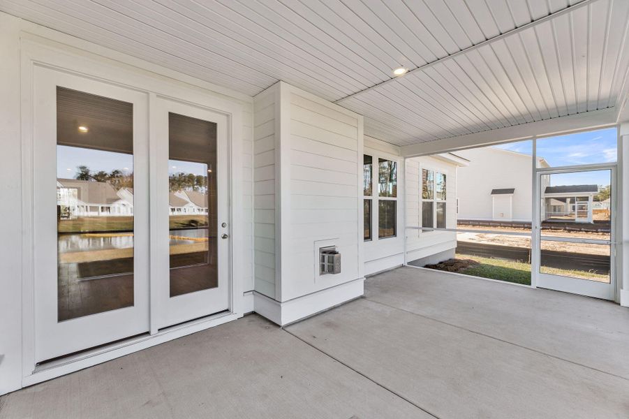Exterior details and patio area of a home in Tidewater at Lakes of Cane Bay, Summerville (Image 18).