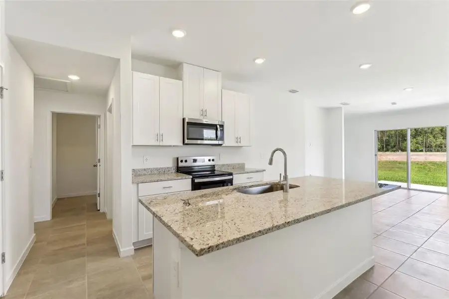 Furnished interior view inside a new home in Flagler Village - Classic Series, Palm Coast (Image 8).
