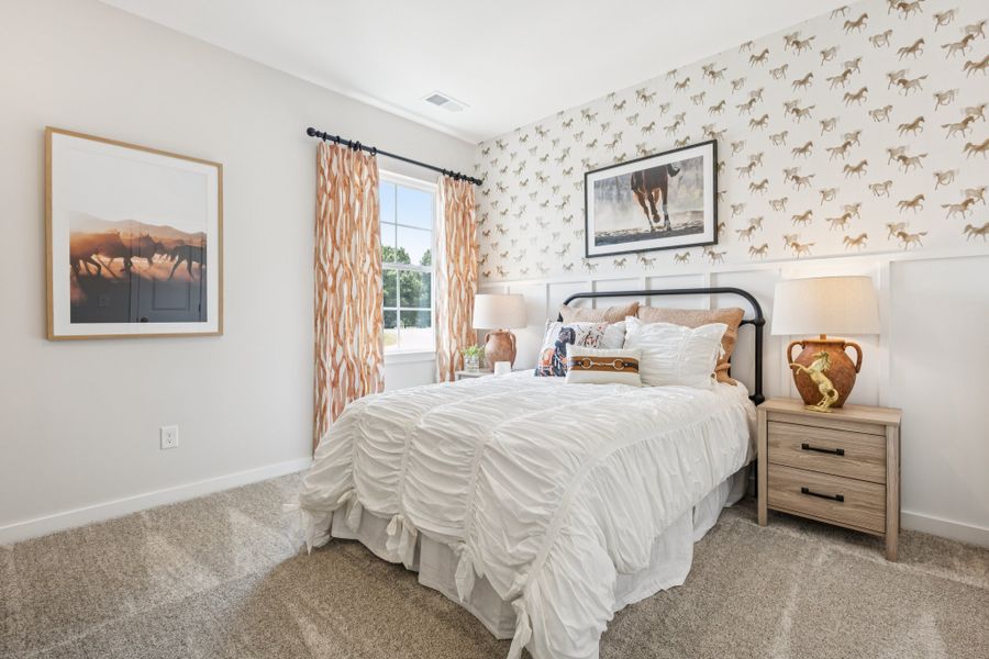 A bedroom with a bed and lamps. A bedroom with a bed and lamps.