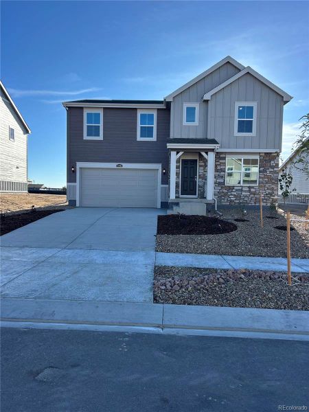 Front exterior of a new home in Percheron: The Camden Collection, Colorado Springs, CO, highlighting curb appeal (Image 1).