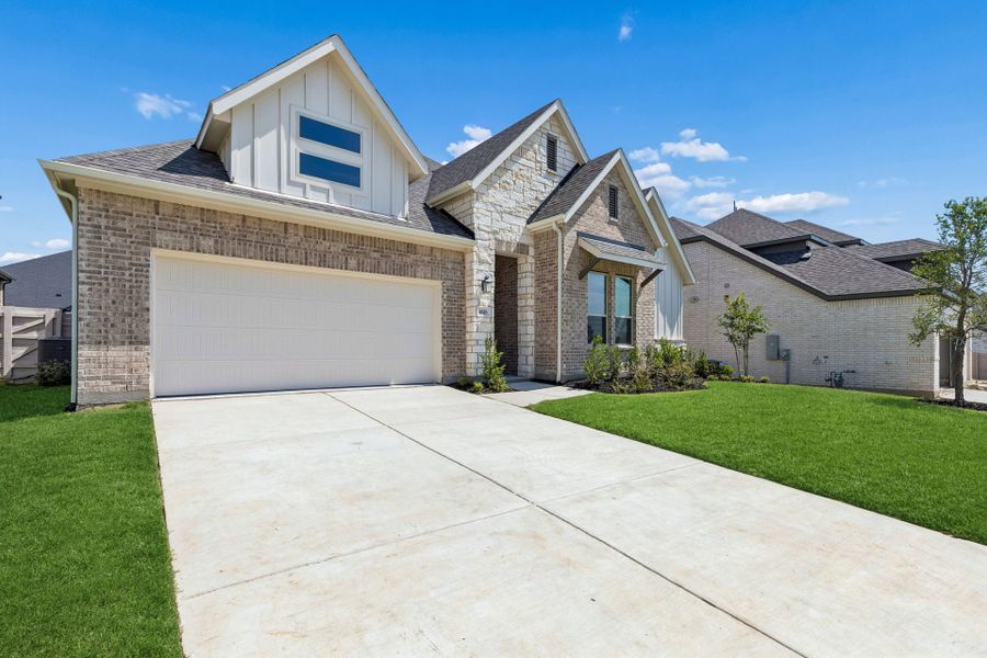 Front exterior of a new home in Painted Tree Lakeside, McKinney, TX, highlighting curb appeal (Image 22).