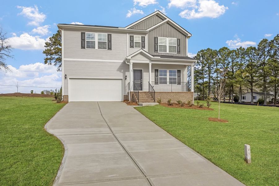 Front exterior of a new home in Cambridge Reserve, Angier, NC, highlighting curb appeal (Image 2). Front exterior of a new home in Cambridge Reserve, Angier, NC, highlighting curb appeal (Image 2).