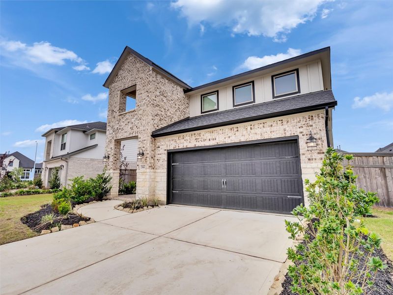 Front exterior of a new home in Cross Creek West, Fulshear, TX, highlighting curb appeal (Image 21).