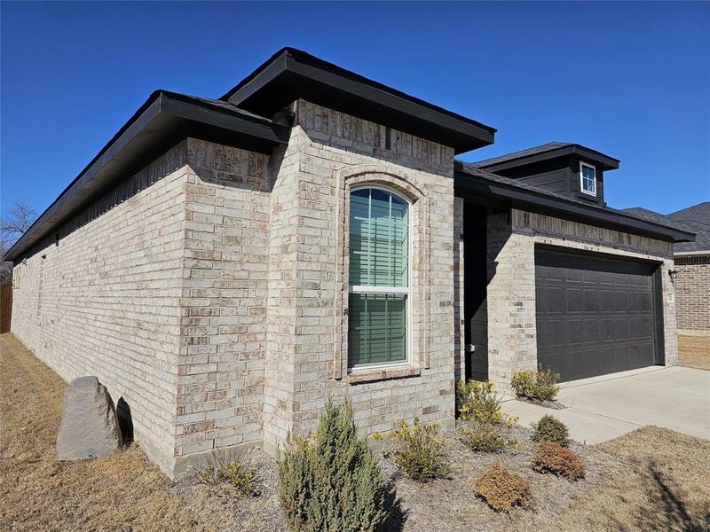 Exterior details and patio area of a home in The Grove, Sherman (Image 3). Exterior details and patio area of a home in The Grove, Sherman (Image 3).