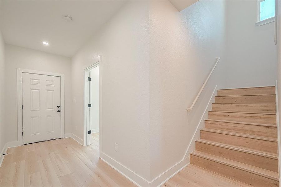 Entry way with staircase leading upstairs