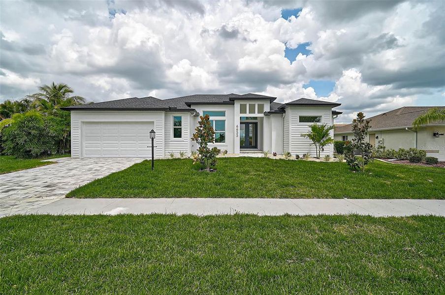 Front exterior of a new home in , North Port, FL, highlighting curb appeal (Image 29).