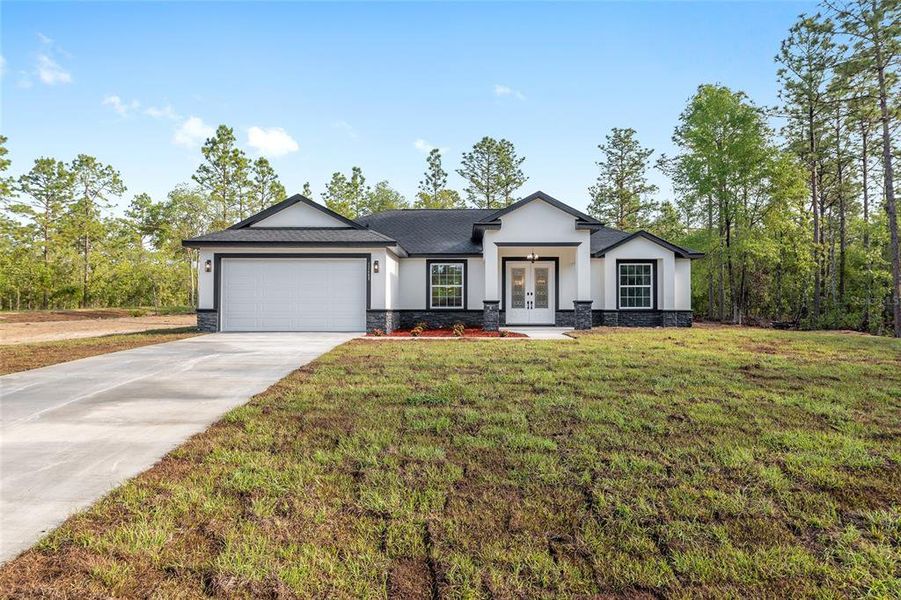 Front exterior of a new home in , Dunnellon, FL, highlighting curb appeal (Image 29).