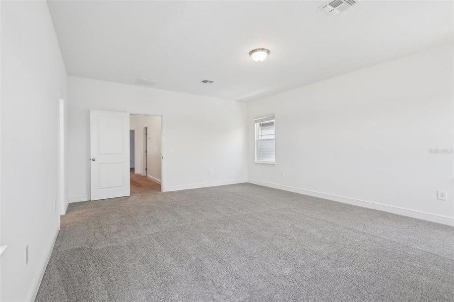 Spacious, unfurnished interior of a new home in Cyrene at Minneola - Villas, Montverde (Image 25).