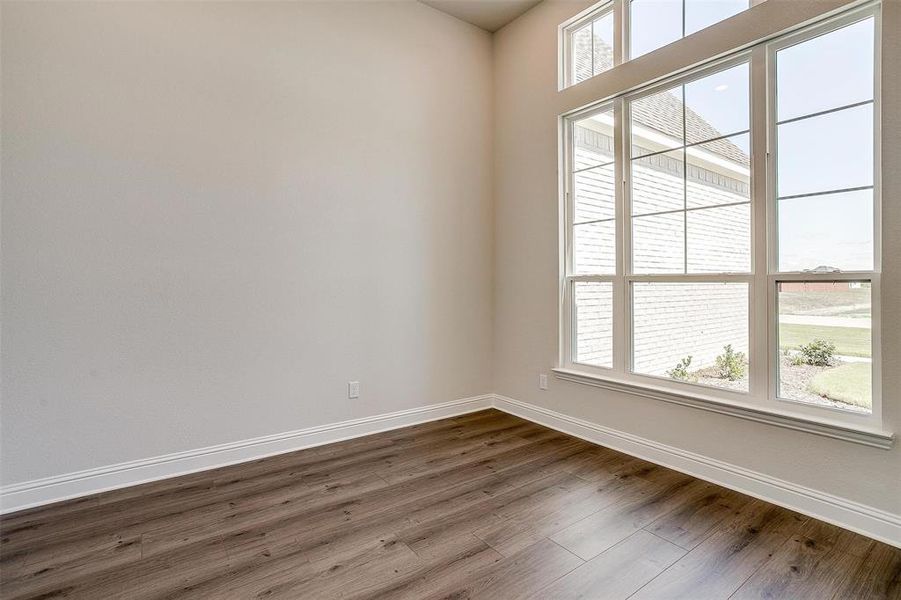 Spare room featuring hardwood / wood-style flooring