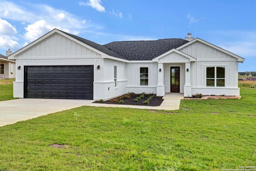 Front exterior of a new home in , La Vernia, TX, highlighting curb appeal (Image 27). Front exterior of a new home in , La Vernia, TX, highlighting curb appeal (Image 27).