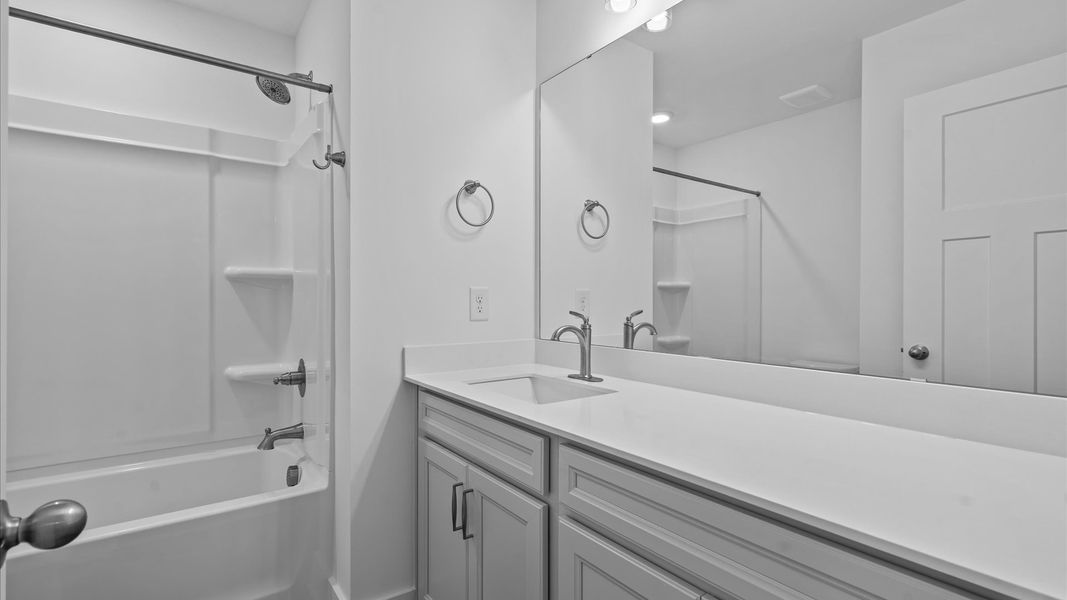 Elegant full bathroom with tasteful finishes and a thoughtfully designed layout