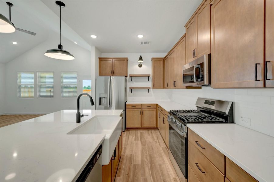 Stylish kitchen with chestnut brown cabinets and floating shelves