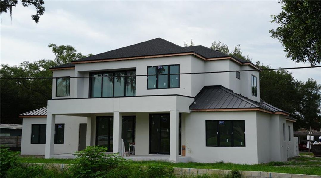 Front exterior of a new home in , Winter Park, FL, highlighting curb appeal (Image 2). Front exterior of a new home in , Winter Park, FL, highlighting curb appeal (Image 2).