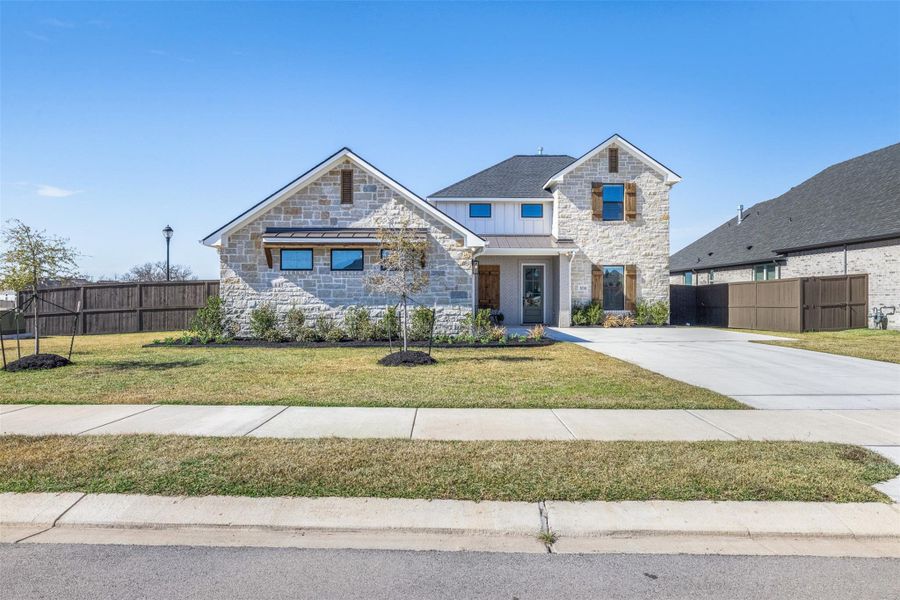 Front exterior of a new home in , Bryan, TX, highlighting curb appeal (Image 26).