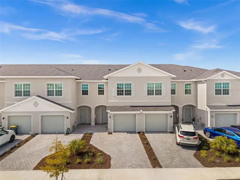 Front exterior of a new home in Tuckers Cove, Punta Gorda, FL, highlighting curb appeal (Image 1). Front exterior of a new home in Tuckers Cove, Punta Gorda, FL, highlighting curb appeal (Image 1).