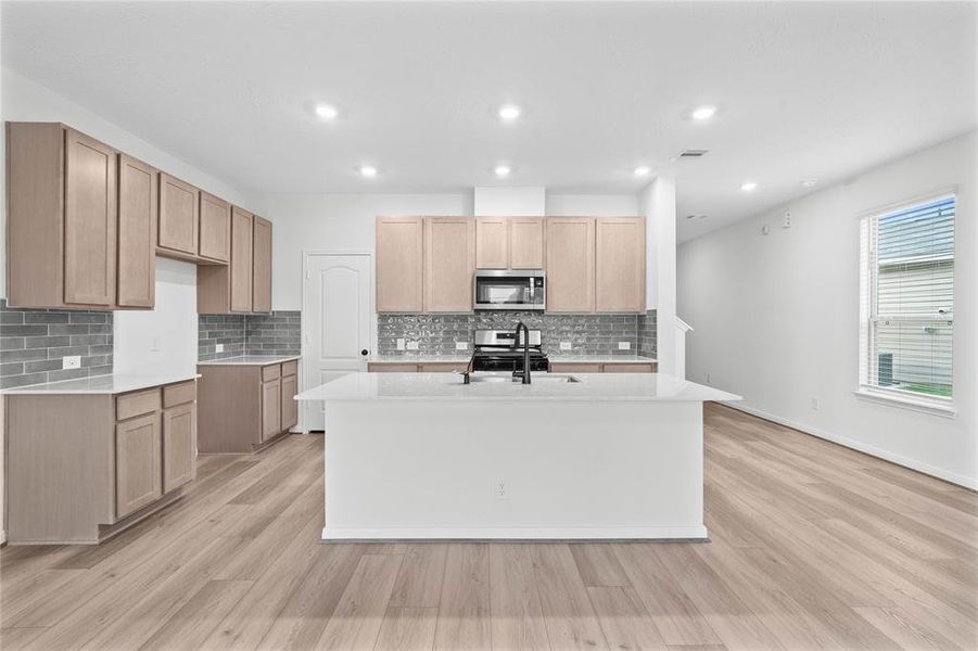 Another view of this beautiful and spacious kitchen!