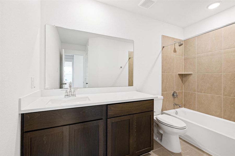 Furnished interior view inside a new home in Sunterra, Katy (Image 13).