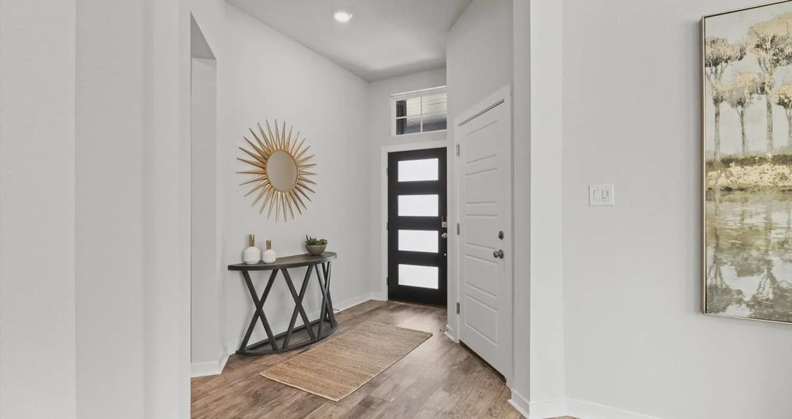 Representative furnished interior of a home built from the Avril by Chesmar Homes in Stream Waters, Buda (Image 16).