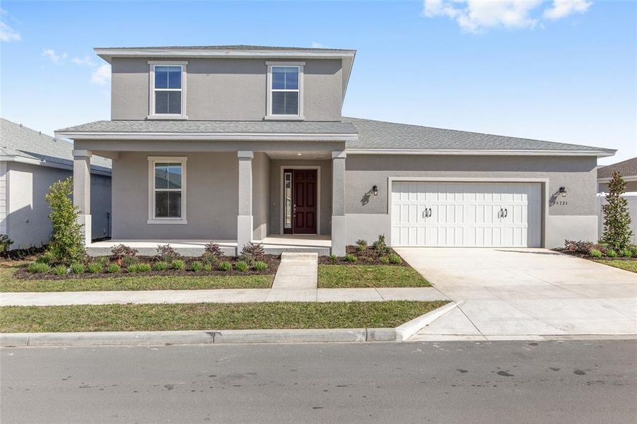 Front exterior of a new home in Calesa Township, Ocala, FL, highlighting curb appeal (Image 24).