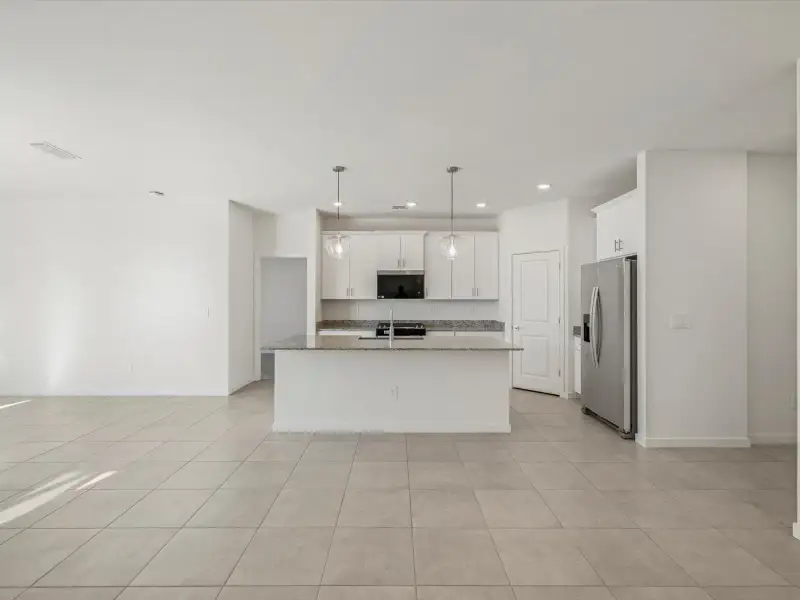 Spacious, unfurnished interior of a new home in Entrada Estate Series, Tolleson (Image 9).