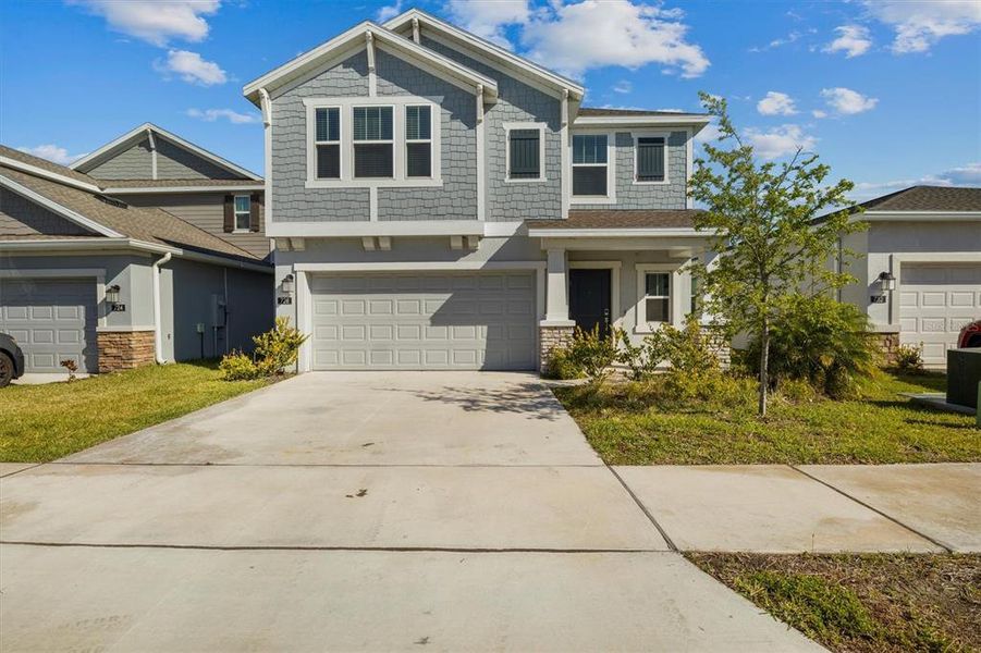 Front exterior of a new home in , Eagle Lake, FL, highlighting curb appeal (Image 1). Front exterior of a new home in , Eagle Lake, FL, highlighting curb appeal (Image 1).