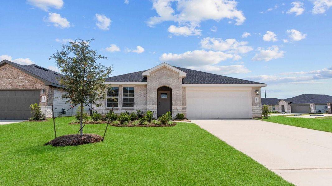 Front exterior of a new home in Tamarron, Fulshear, TX, highlighting curb appeal (Image 2). Front exterior of a new home in Tamarron, Fulshear, TX, highlighting curb appeal (Image 2).