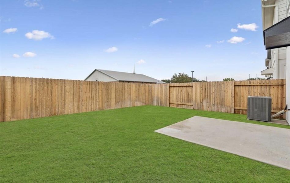 Exterior details and patio area of a home in Park Hill Villas, Stafford (Image 18).