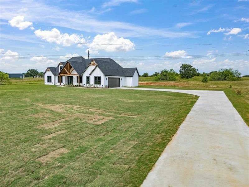 Front exterior of a new home in , Alvord, TX, highlighting curb appeal (Image 28).