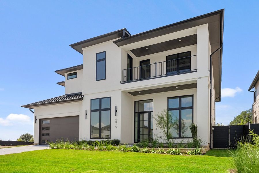 Front exterior of a new home in Milky Way at River Place, Austin, TX, highlighting curb appeal (Image 2).