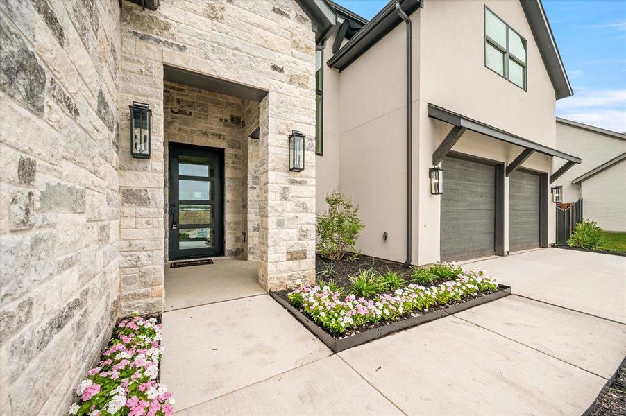 Doorway to property featuring a garage