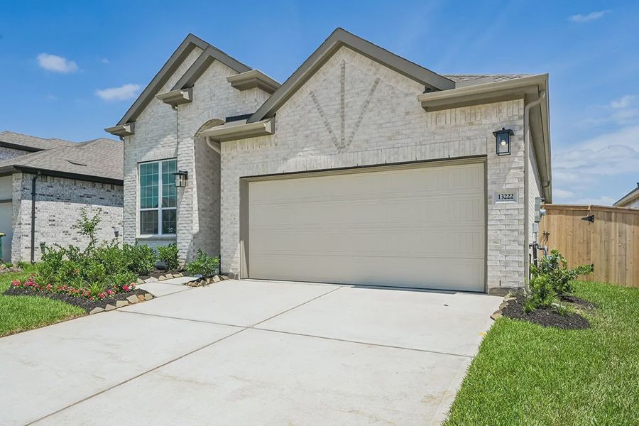 Front exterior of a new home in Wood Leaf Reserve, Tomball, TX, highlighting curb appeal (Image 19). Front exterior of a new home in Wood Leaf Reserve, Tomball, TX, highlighting curb appeal (Image 19).