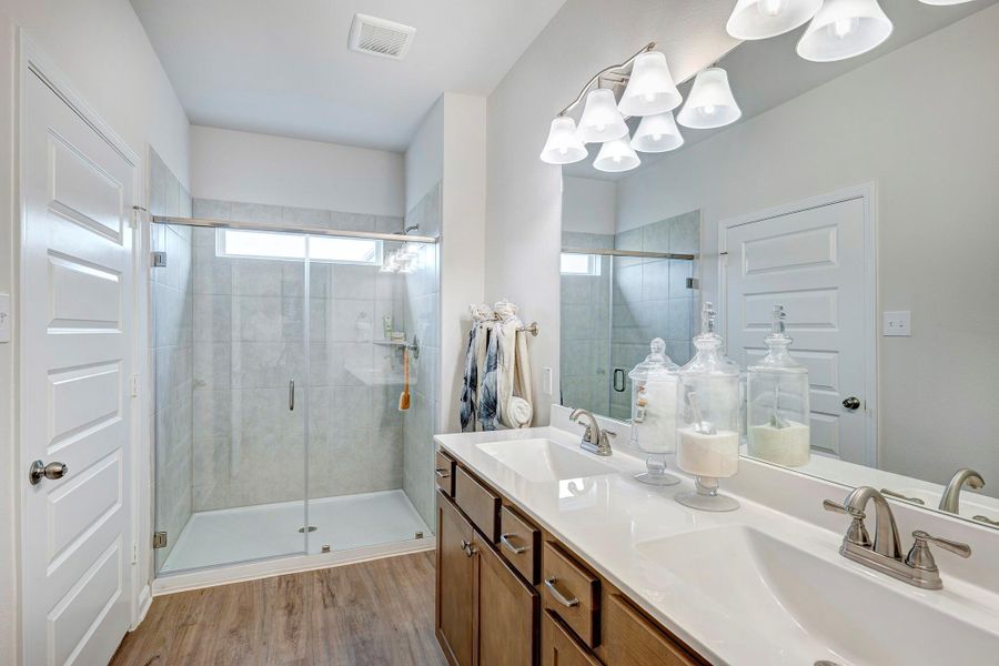 The Piedmont- Primary Bath with Dual Vanities and Walk-In Shower The Piedmont- Primary Bath with Dual Vanities and Walk-In Shower