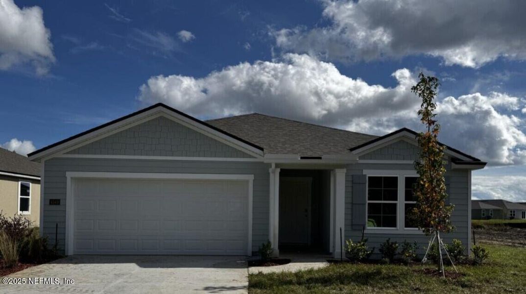 Front exterior of a new home in The Arbors, Jacksonville, FL, highlighting curb appeal (Image 1). Front exterior of a new home in The Arbors, Jacksonville, FL, highlighting curb appeal (Image 1).