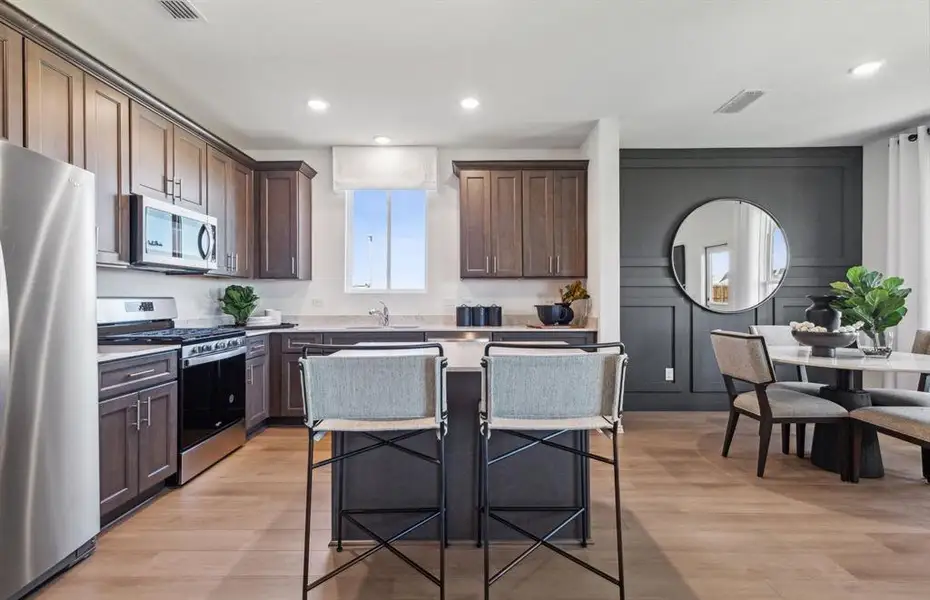 *Model Representation - Spacious kitchen with eat-in bartop island