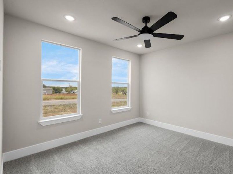 Carpeted empty room featuring recessed lighting and ceiling fan