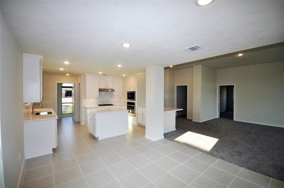 LED lighting and Ceramic Tile flooring through the Breakfast room and kitchen.