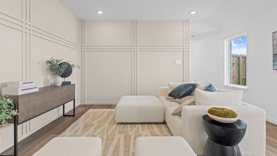 A cozy living room featuring a comfortable couch, a stylish coffee table, and an elegant painting on the wall.