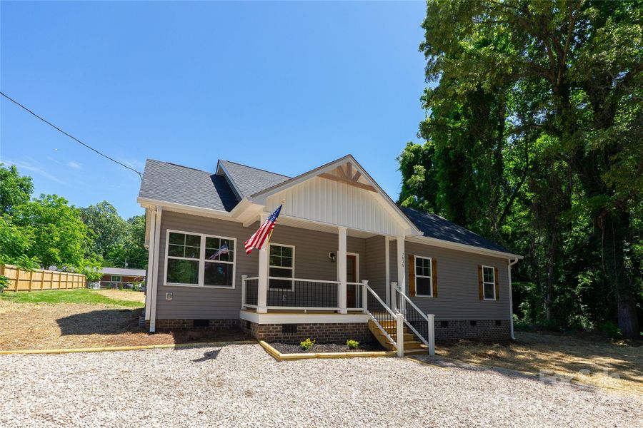 Front exterior of a new home in , Huntersville, NC, highlighting curb appeal (Image 2).