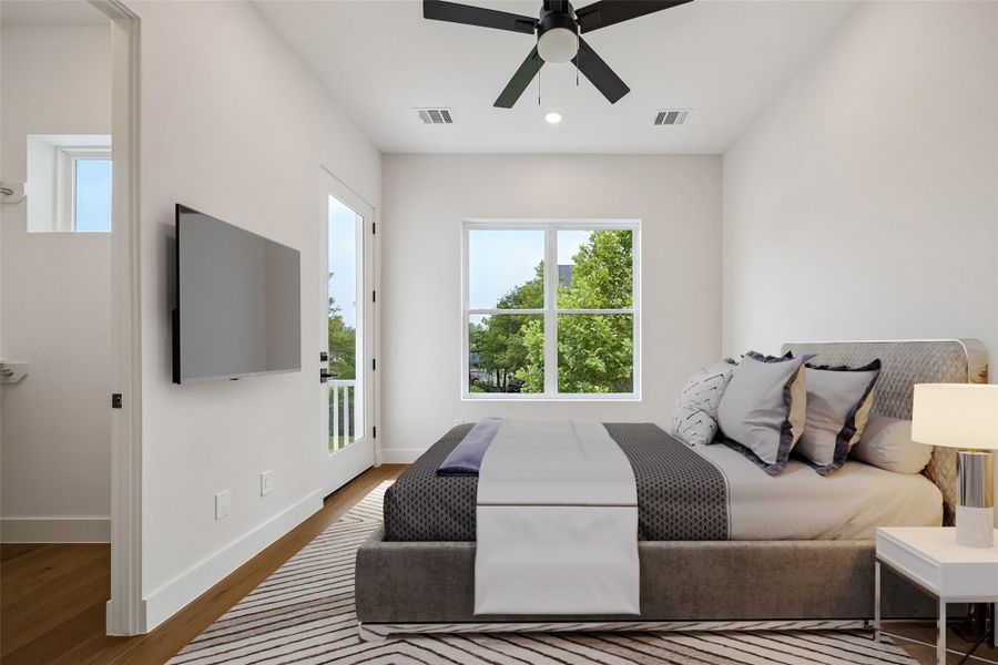 The secondary bedroom was designed with flexibility in mind while maintaining the same clean finish palette seen throughout the home. Large windows and elevated ceiling heights help the space feel bright and comfortable throughout the day. (digitally staged) The secondary bedroom was designed with flexibility in mind while maintaining the same clean finish palette seen throughout the home. Large windows and elevated ceiling heights help the space feel bright and comfortable throughout the day. (digitally staged)