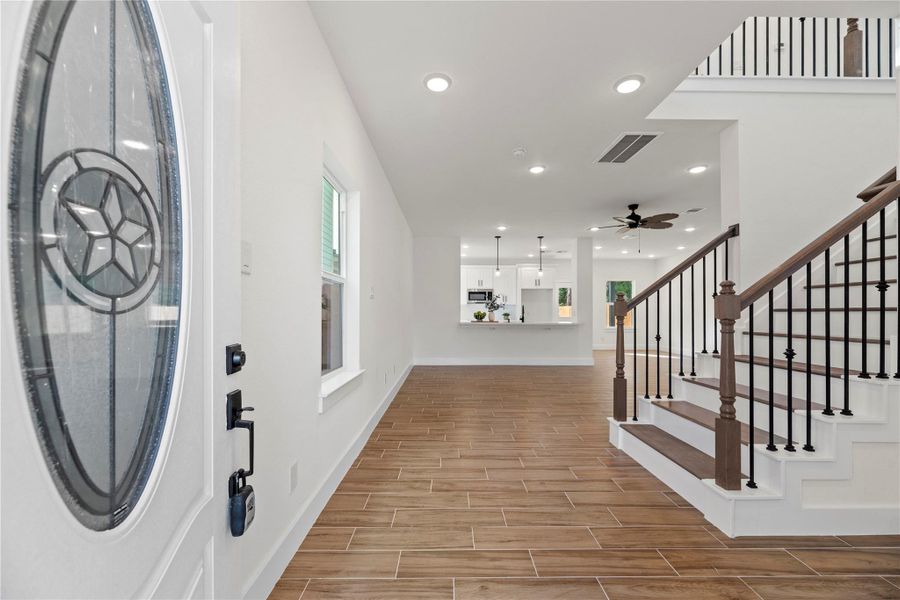 Entering the home, guests are met with durable tile flooring, which is accented with thick white baseboards. Entering the home, guests are met with durable tile flooring, which is accented with thick white baseboards.