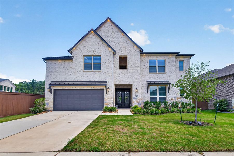 Front exterior of a new home in The Trails, New Caney, TX, highlighting curb appeal (Image 2). Front exterior of a new home in The Trails, New Caney, TX, highlighting curb appeal (Image 2).