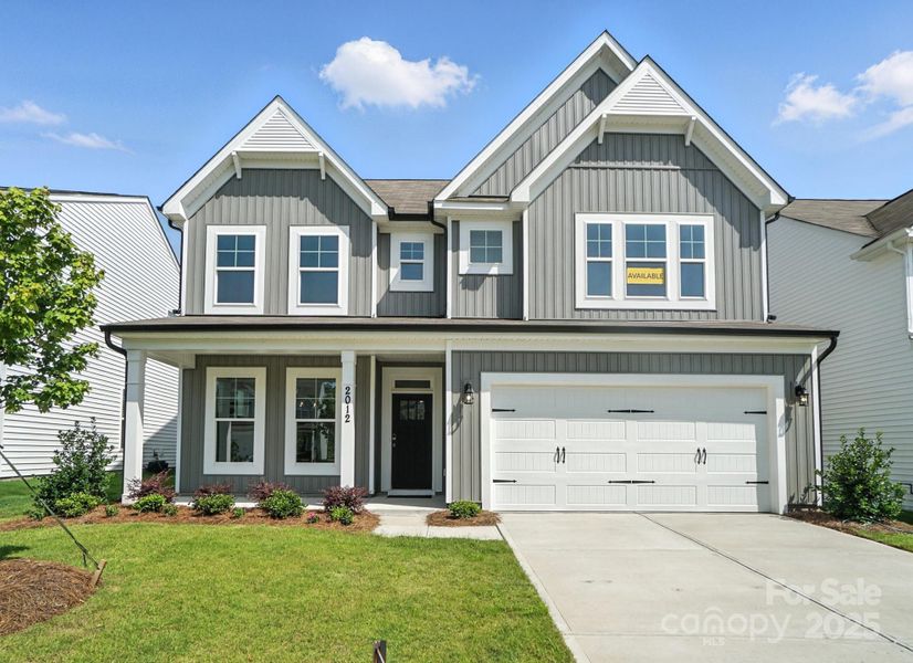 Front exterior of a new home in Hampton Woods, Charlotte, NC, highlighting curb appeal (Image 24).